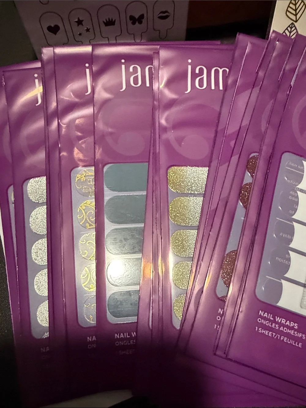 Jamberry Nail Wraps Assorted Styles in Purple Packaging
